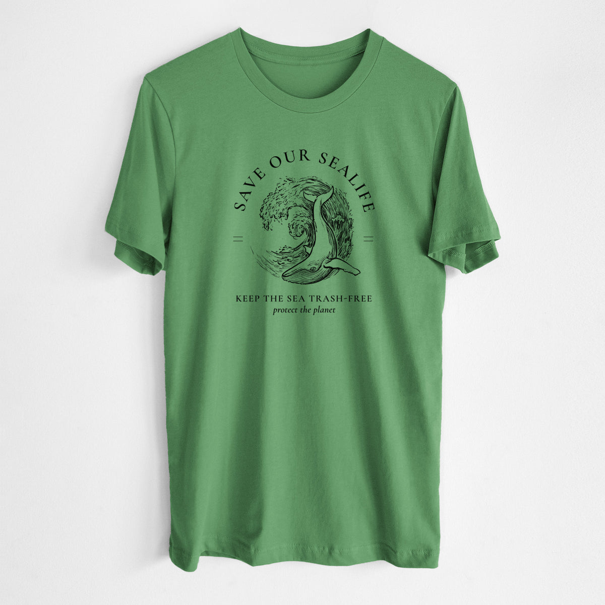 Leaf green lightweight cotton t-shirt laid flat, printed with a black ink whale in an ocean wave framed by the words Save Our Sealife, Keep the Sea Trash-Free.