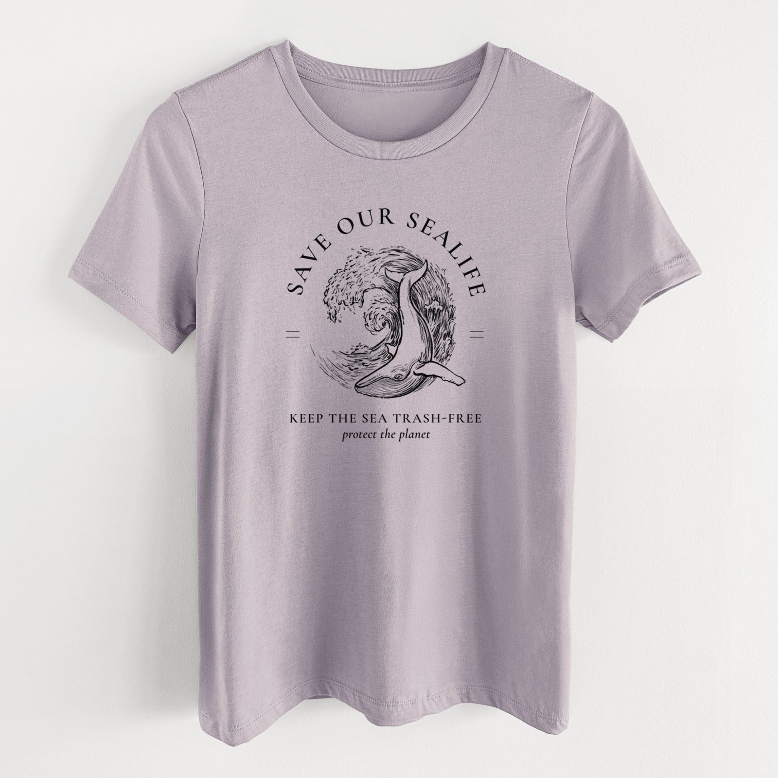 Light violet women's relaxed fit cotton t-shirt laid flat, printed with a black ink whale in an ocean wave framed by the words Save Our Sealife, Keep the Sea Trash-Free.