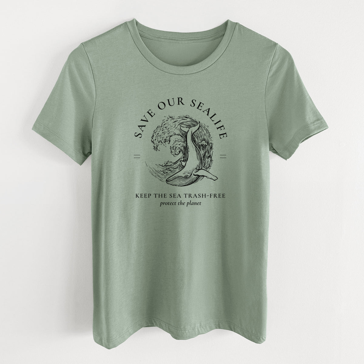 Sage green women's relaxed fit cotton t-shirt laid flat, printed with a black ink whale in an ocean wave framed by the words Save Our Sealife, Keep the Sea Trash-Free.