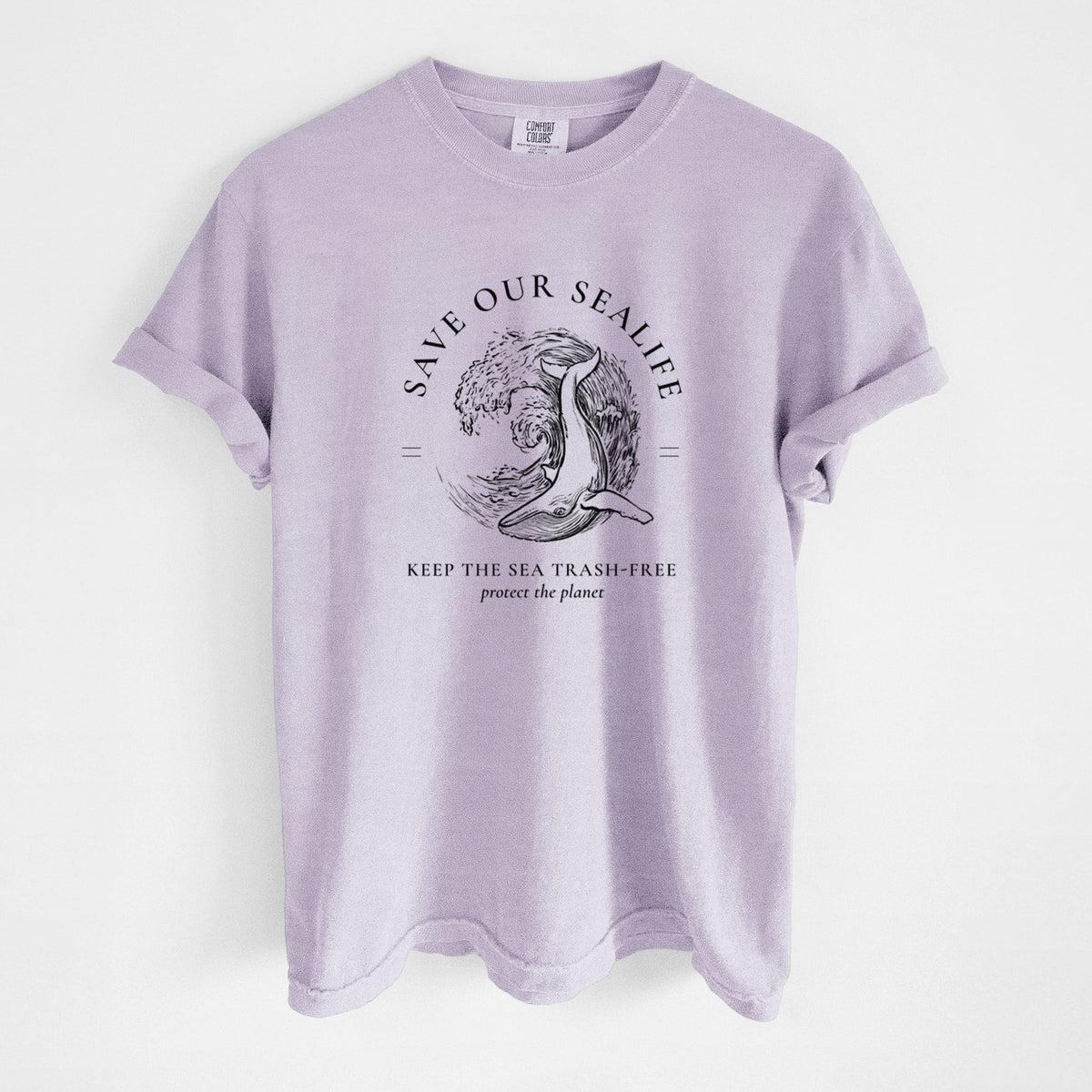 Orchid purple Comfort Colors t-shirt laid flat, printed with a black ink whale in an ocean wave framed by the words Save Our Sealife, Keep the Sea Trash-Free.