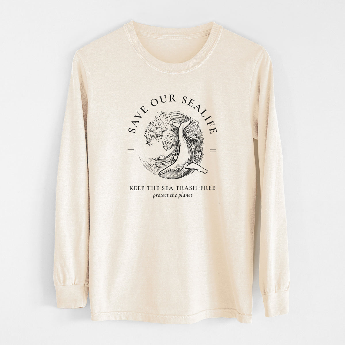 Ivory Comfort Colors long sleeve shirt laid flat, printed with a black ink whale in an ocean wave framed by the words Save Our Sealife, Keep the Sea Trash-Free.