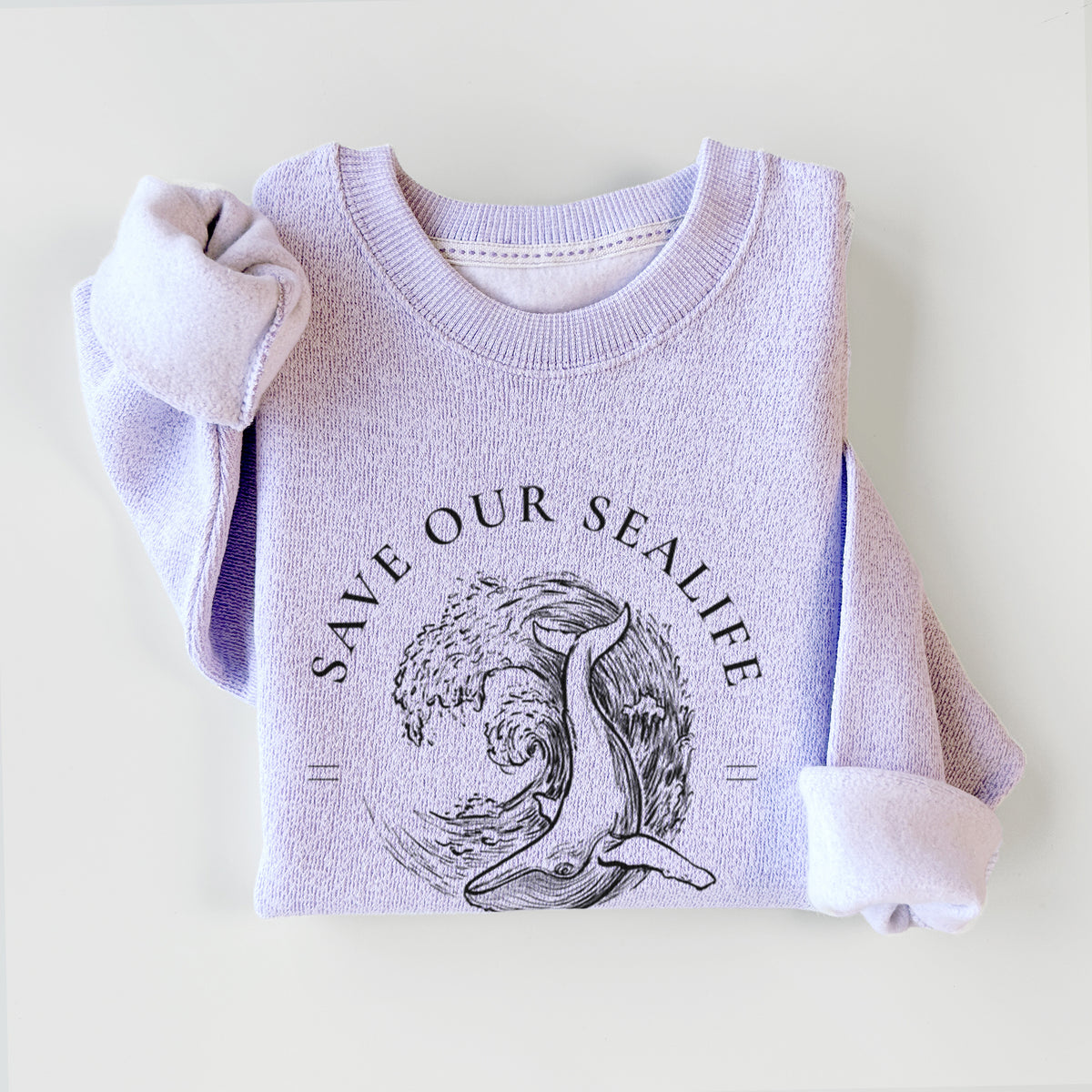 Ice purple knit sweatshirt printed with a black ink whale in an ocean wave framed by the words Save Our Sealife, Keep the Sea Trash-Free, styled flat.
