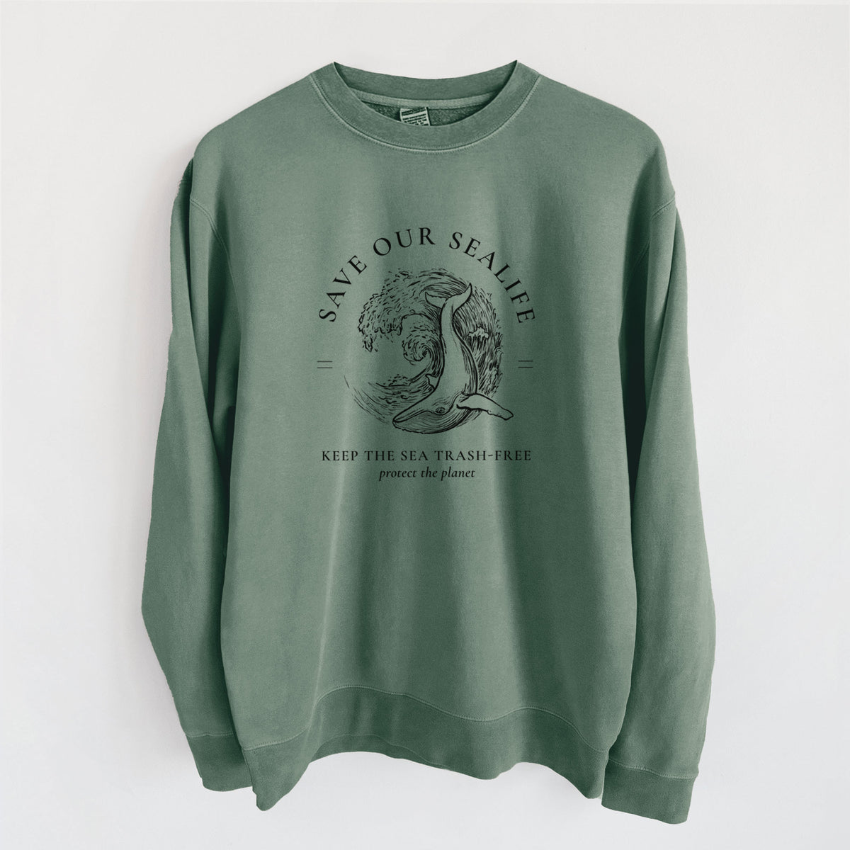 Alpine green pigment dyed crewneck sweatshirt laid flat, printed with a black ink whale in an ocean wave framed by the words Save Our Sealife, Keep the Sea Trash-Free.