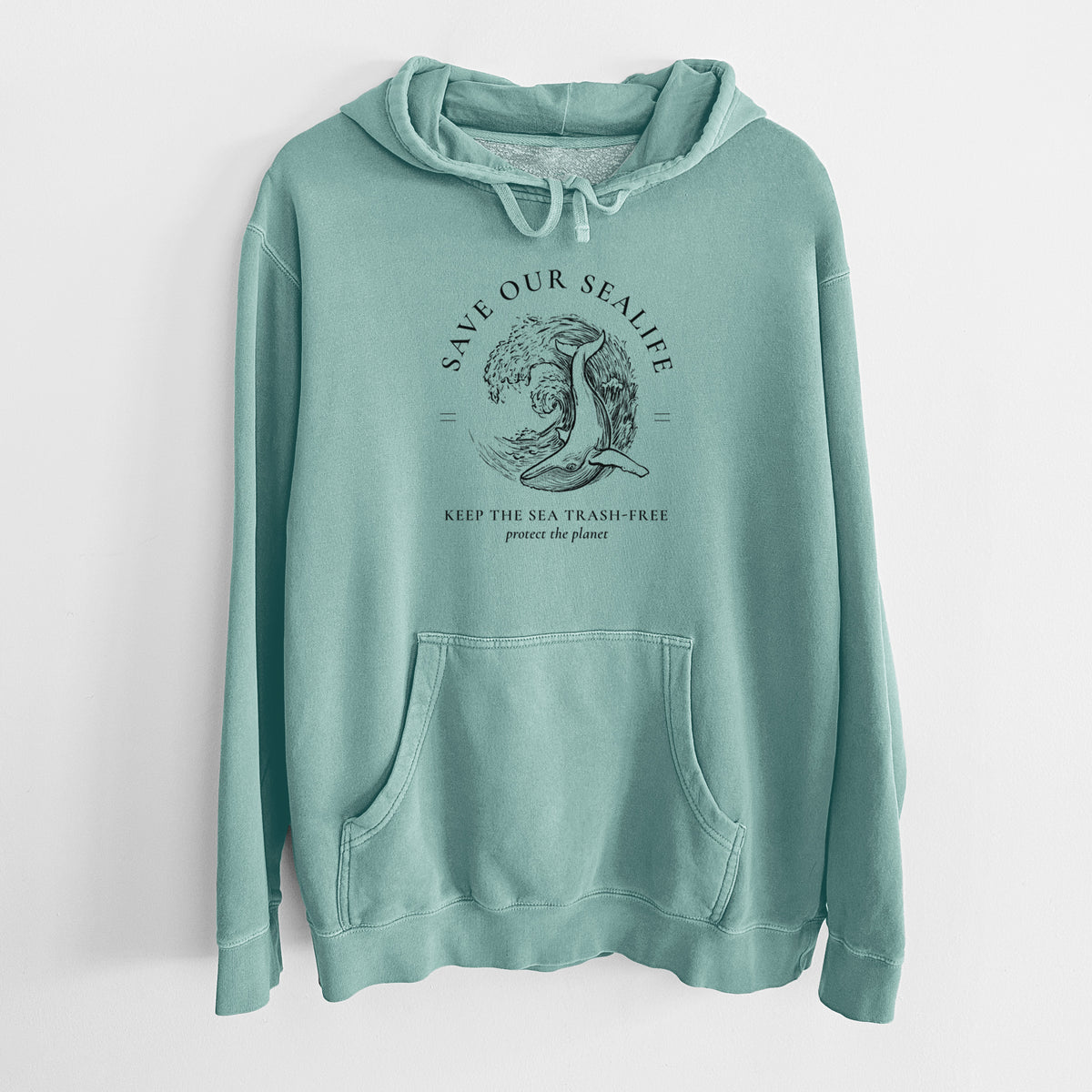 Mint green pigment dyed hoodie laid flat, printed with a black ink whale in an ocean wave framed by the words Save Our Sealife, Keep the Sea Trash-Free.
