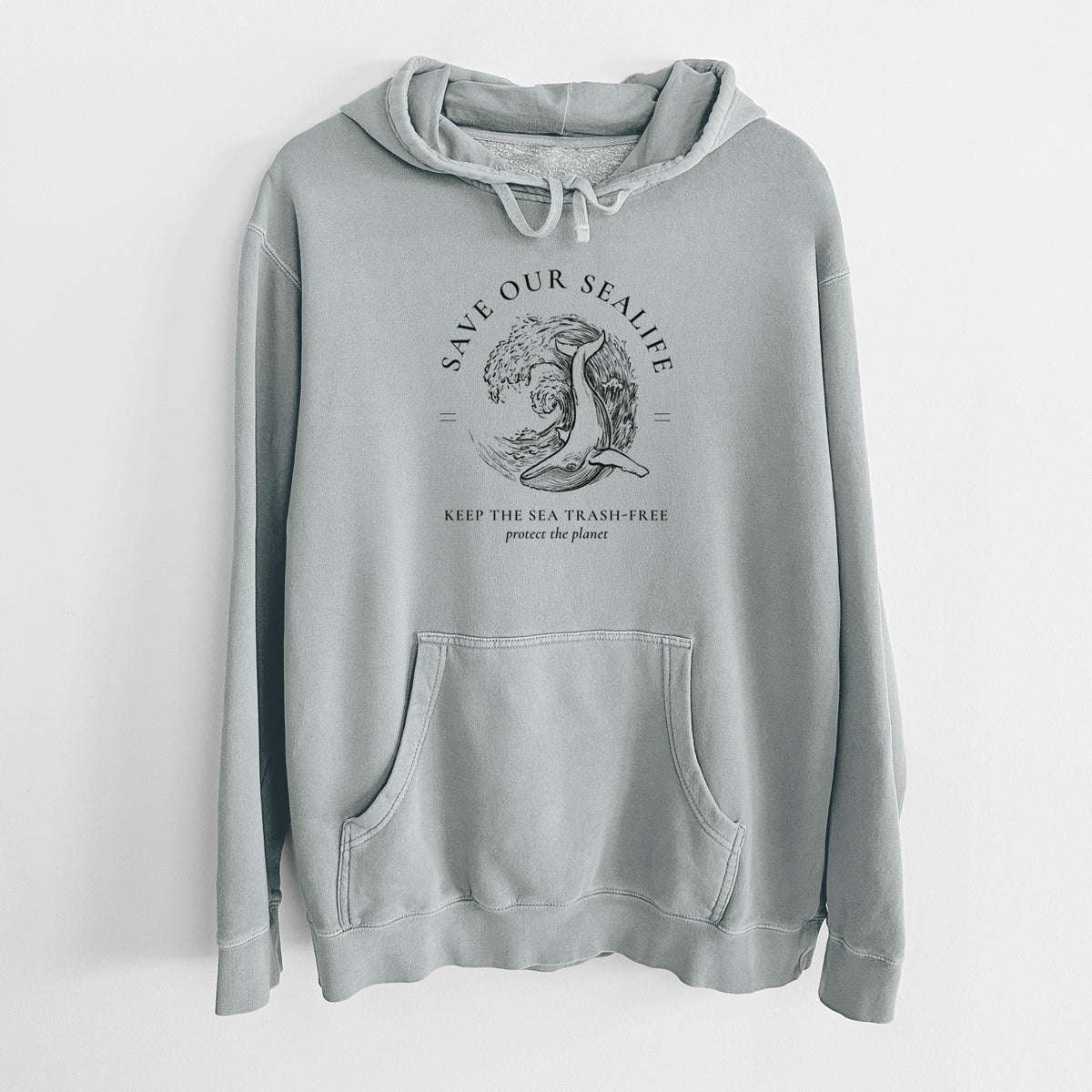 Sage green pigment dyed hoodie laid flat, printed with a black ink whale in an ocean wave framed by the words Save Our Sealife, Keep the Sea Trash-Free.