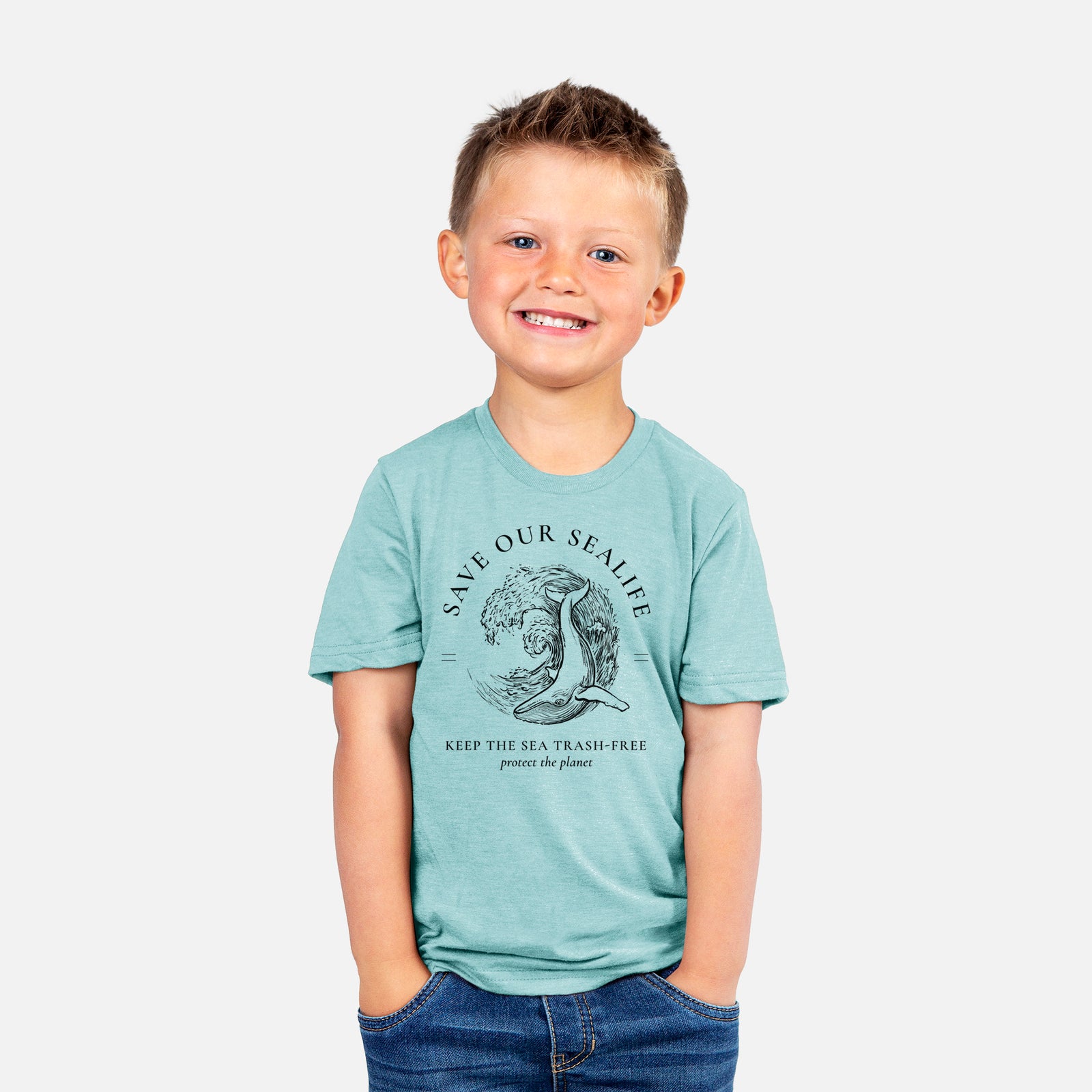 Two youth t-shirts in different colors on hangers, printed with a black ink whale in an ocean wave framed by the words Save Our Sealife, Keep the Sea Trash-Free.