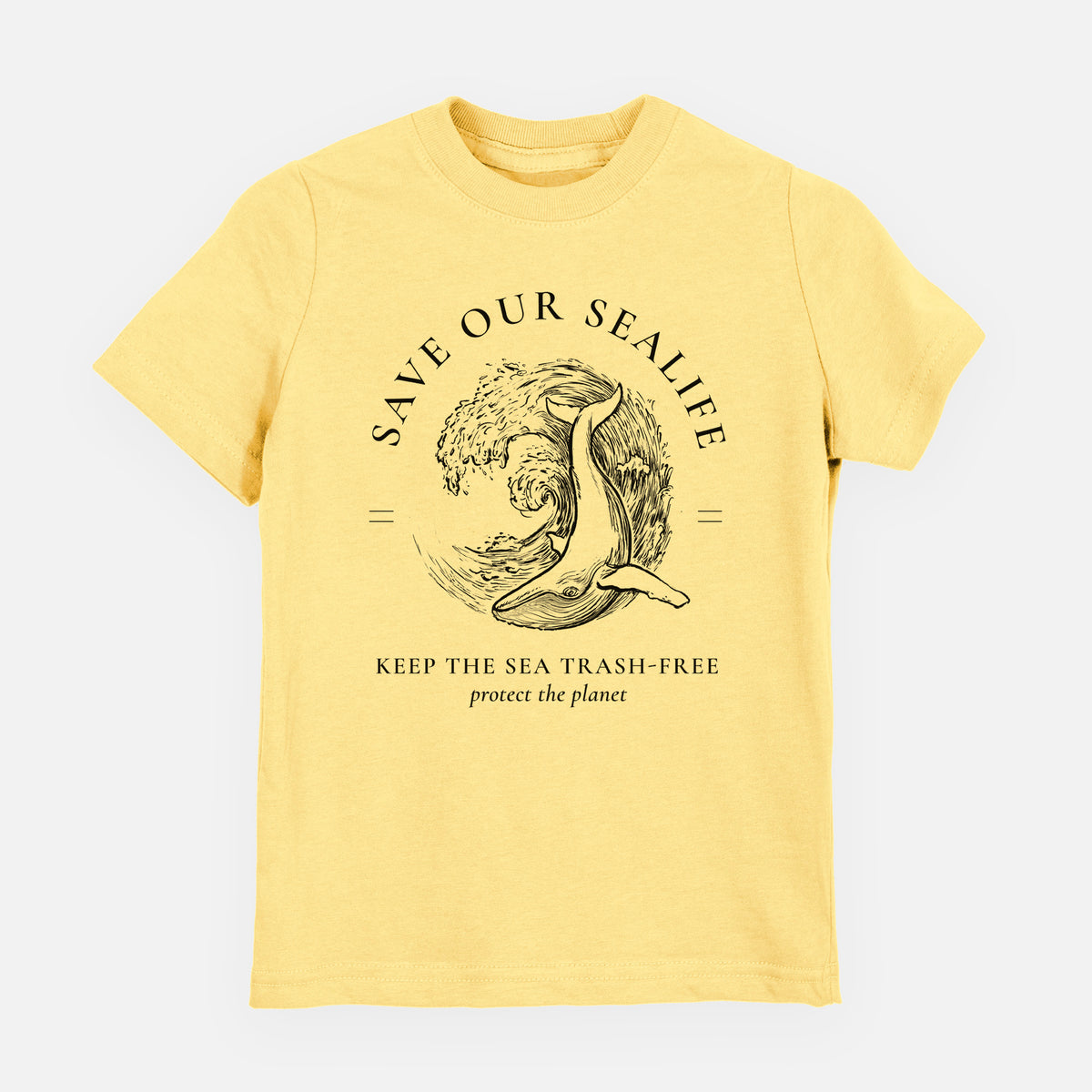Butter yellow youth t-shirt laid flat, printed with a black ink whale in an ocean wave framed by the words Save Our Sealife, Keep the Sea Trash-Free.