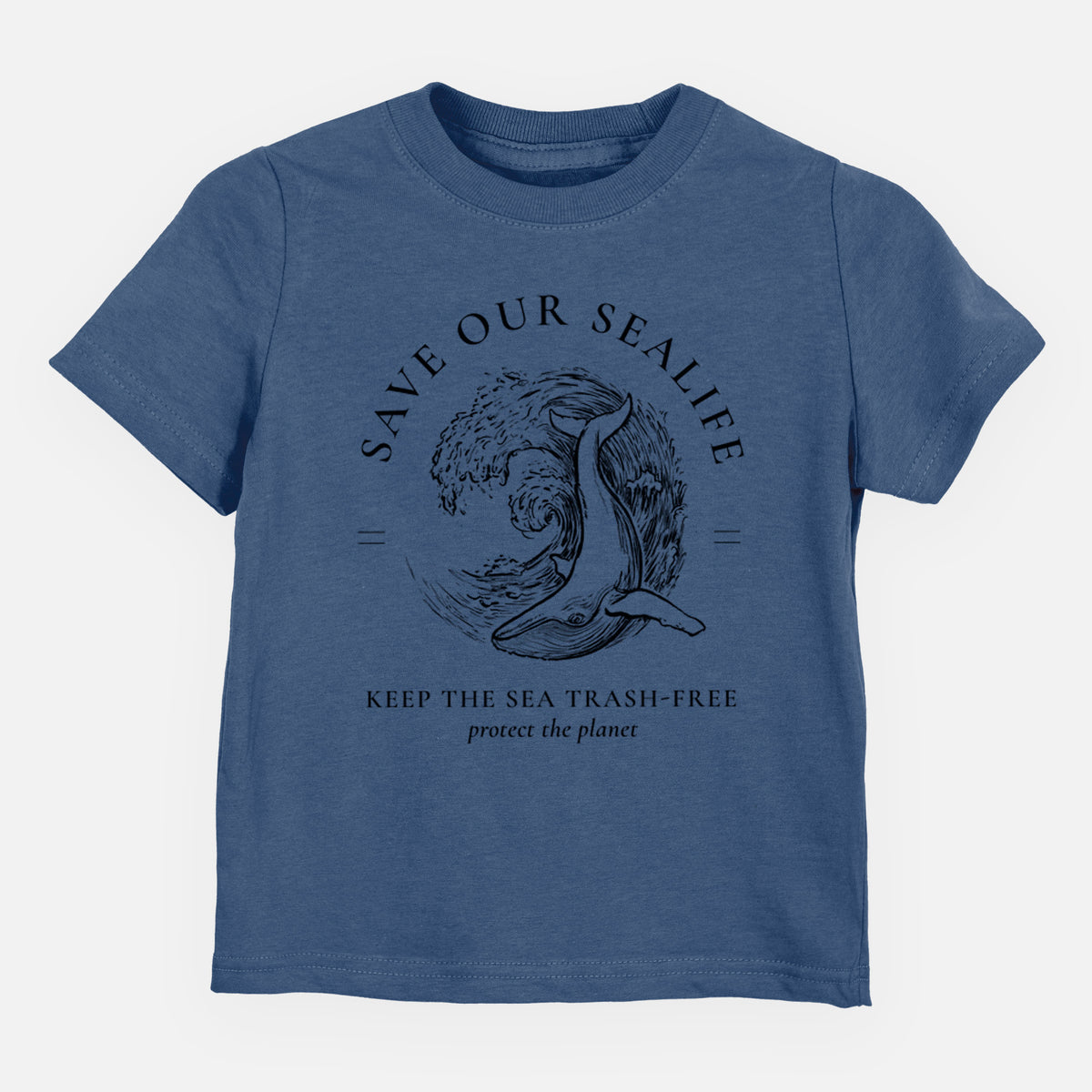 Indigo blue toddler t-shirt laid flat, printed with a black ink whale in an ocean wave framed by the words Save Our Sealife, Keep the Sea Trash-Free.
