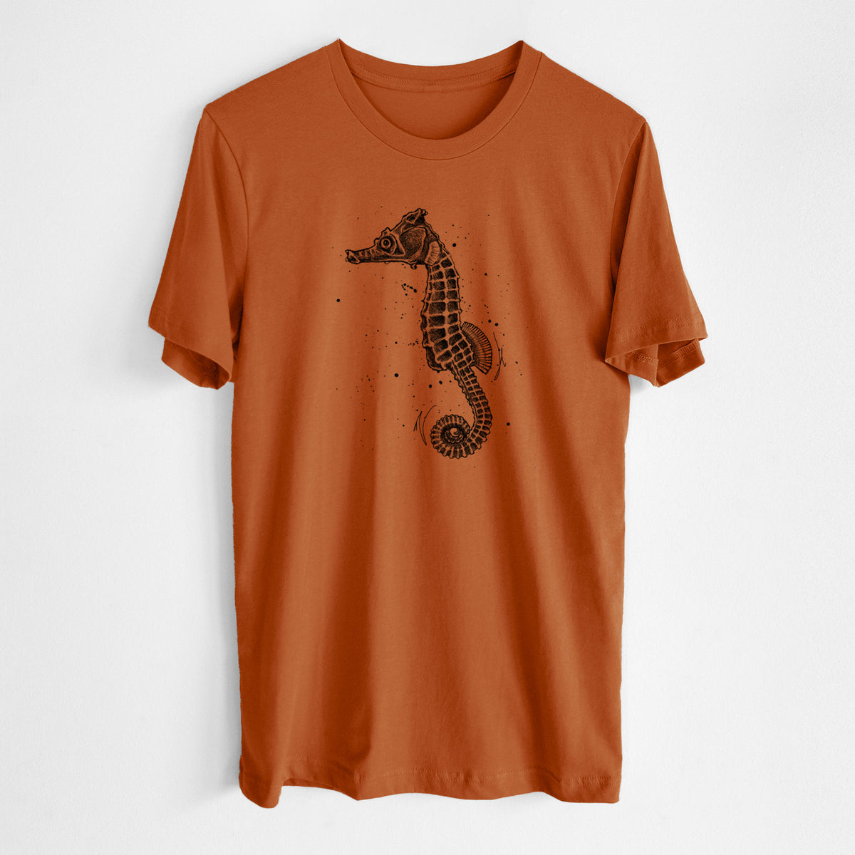 Autumn lightweight cotton t-shirt laid flat, printed with a detailed black ink illustration of a Pacific seahorse with its tail curled.