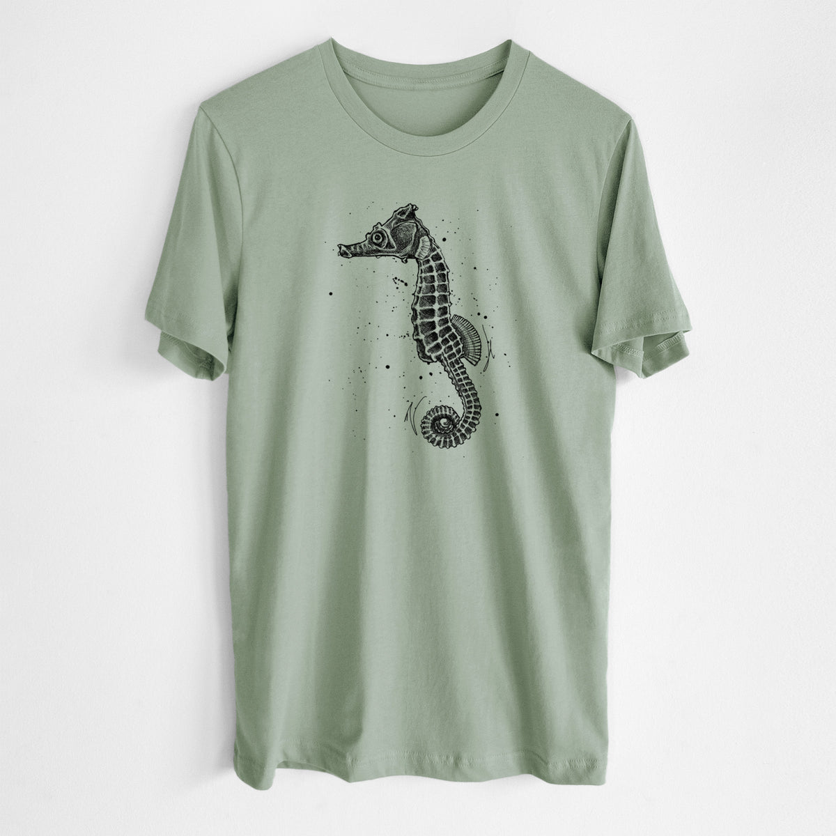 Sage green lightweight cotton t-shirt laid flat, printed with a detailed black ink illustration of a Pacific seahorse with its tail curled.