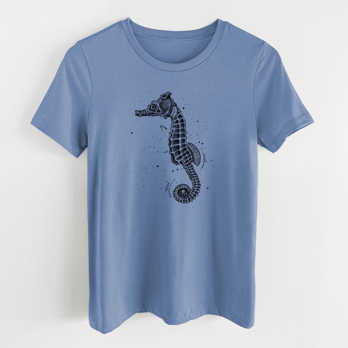 Blue bell women's relaxed fit cotton t-shirt laid flat, printed with a detailed black ink illustration of a Pacific seahorse with its tail curled.