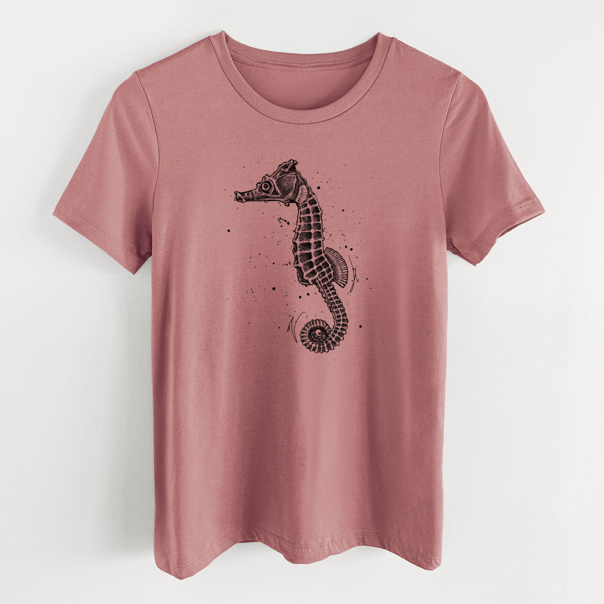 Mauve pink women's relaxed fit cotton t-shirt laid flat, printed with a detailed black ink illustration of a Pacific seahorse with its tail curled.