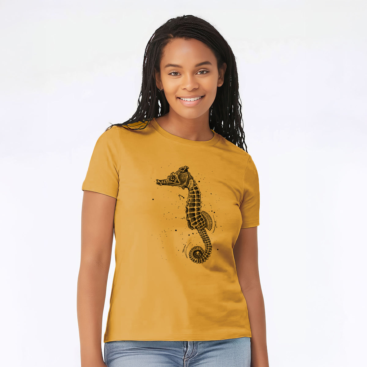 Woman wearing a mustard yellow women's relaxed fit cotton t-shirt printed with a detailed black ink illustration of a Pacific seahorse with its tail curled.