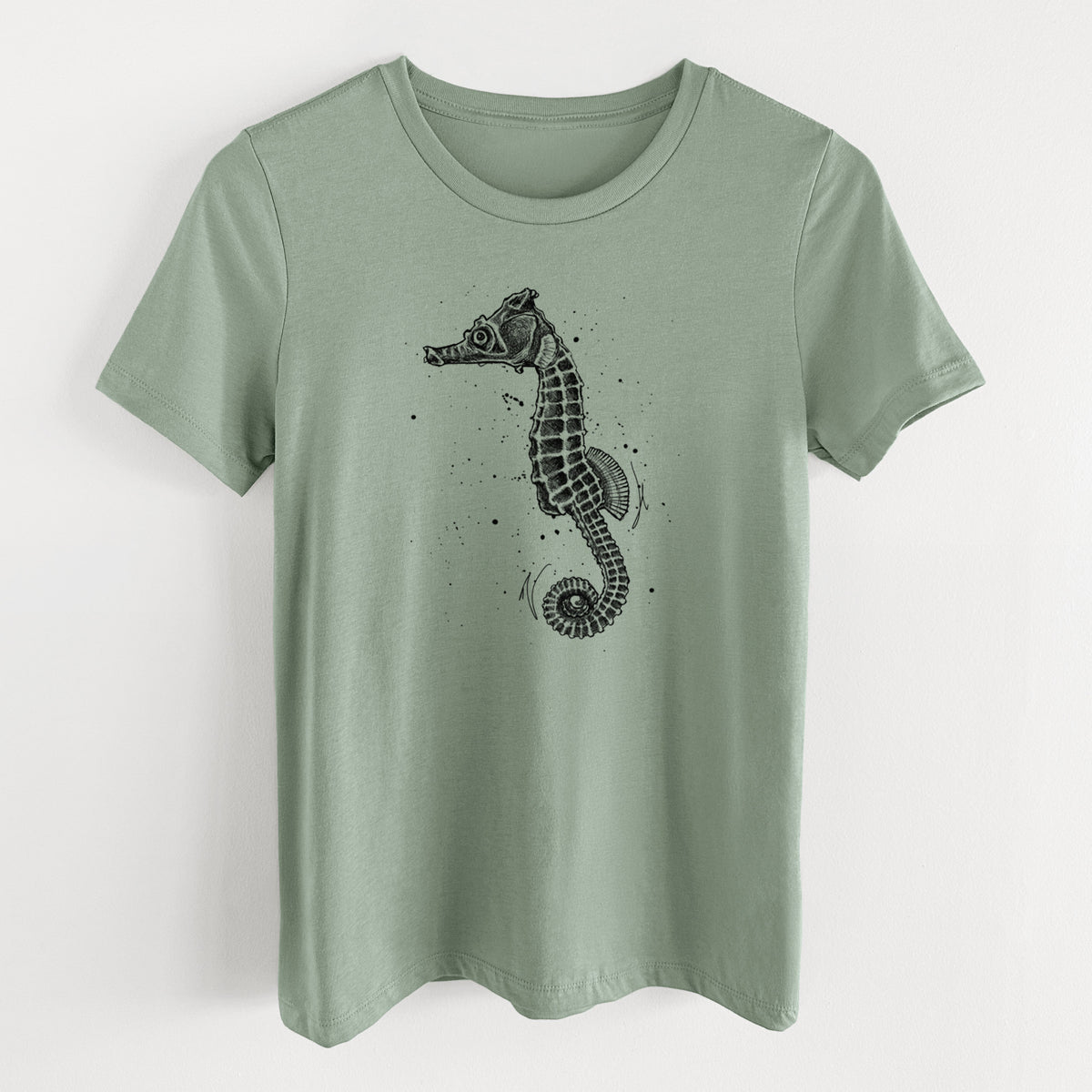 Sage green women's relaxed fit cotton t-shirt laid flat, printed with a detailed black ink illustration of a Pacific seahorse with its tail curled.