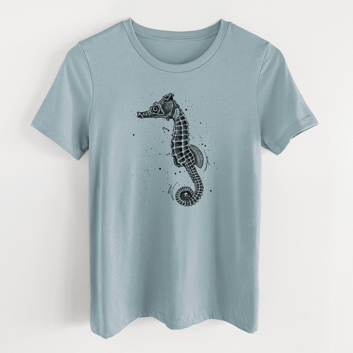 Vintage denim women's relaxed fit cotton t-shirt laid flat, printed with a detailed black ink illustration of a Pacific seahorse with its tail curled.