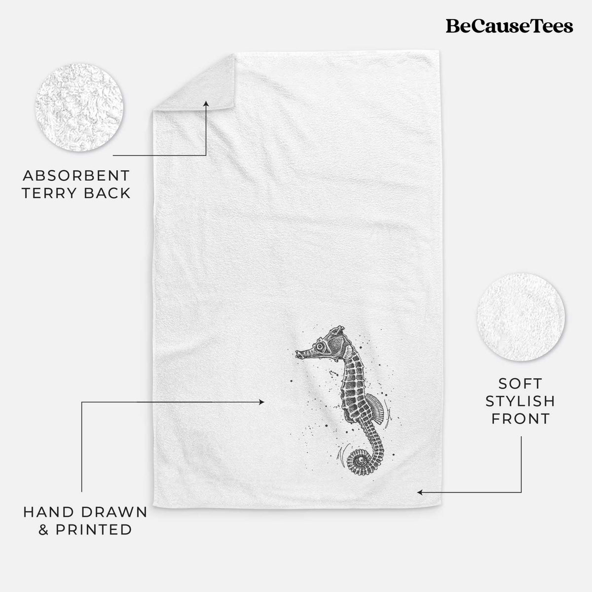 White hand towel printed with a detailed black ink illustration of a Pacific seahorse with its tail curled.