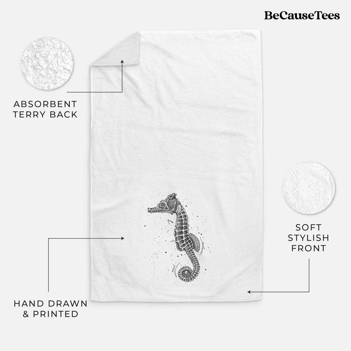 White hand towel printed with a detailed black ink illustration of a Pacific seahorse with its tail curled.