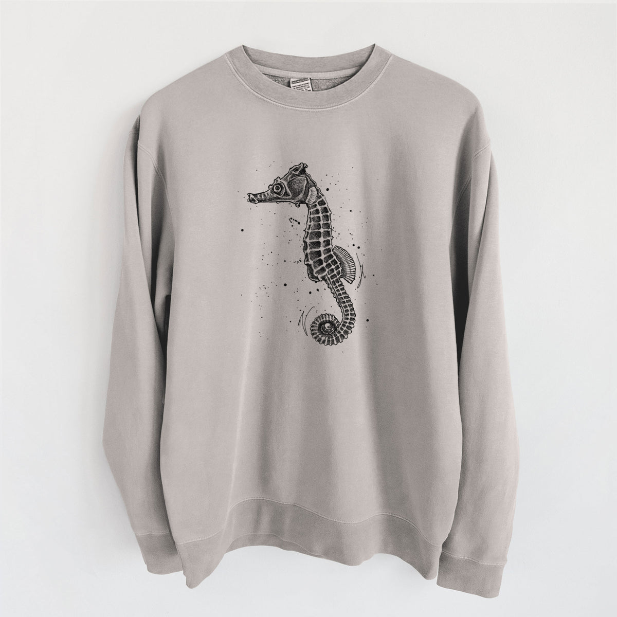 Cement grey pigment dyed crewneck sweatshirt laid flat, printed with a detailed black ink illustration of a Pacific seahorse with its tail curled.