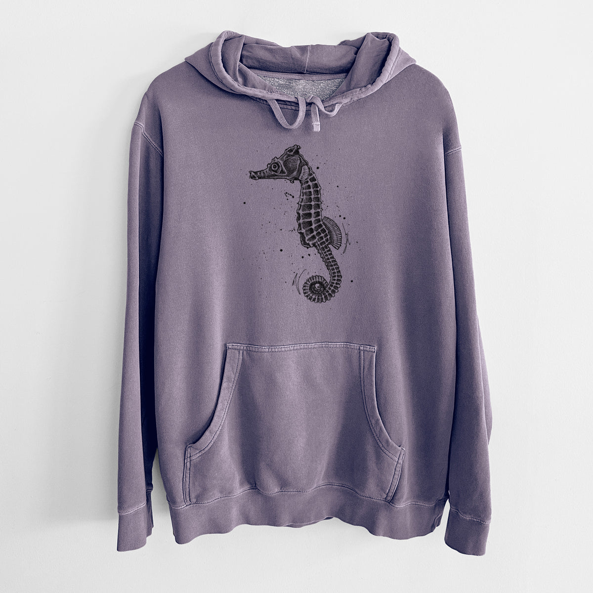 Plum purple pigment dyed hoodie laid flat, printed with a detailed black ink illustration of a Pacific seahorse with its tail curled.