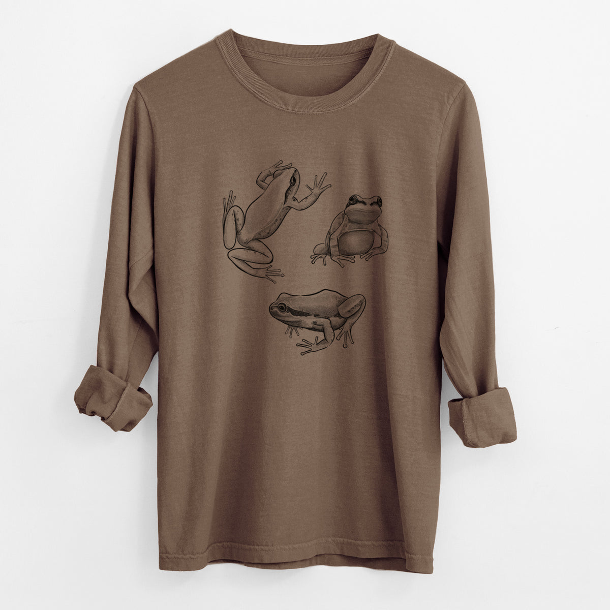 Espresso brown Comfort Colors long sleeve shirt laid flat with the cuffs rolled, printed with a black ink illustration of three Pacific tree frogs in different poses.