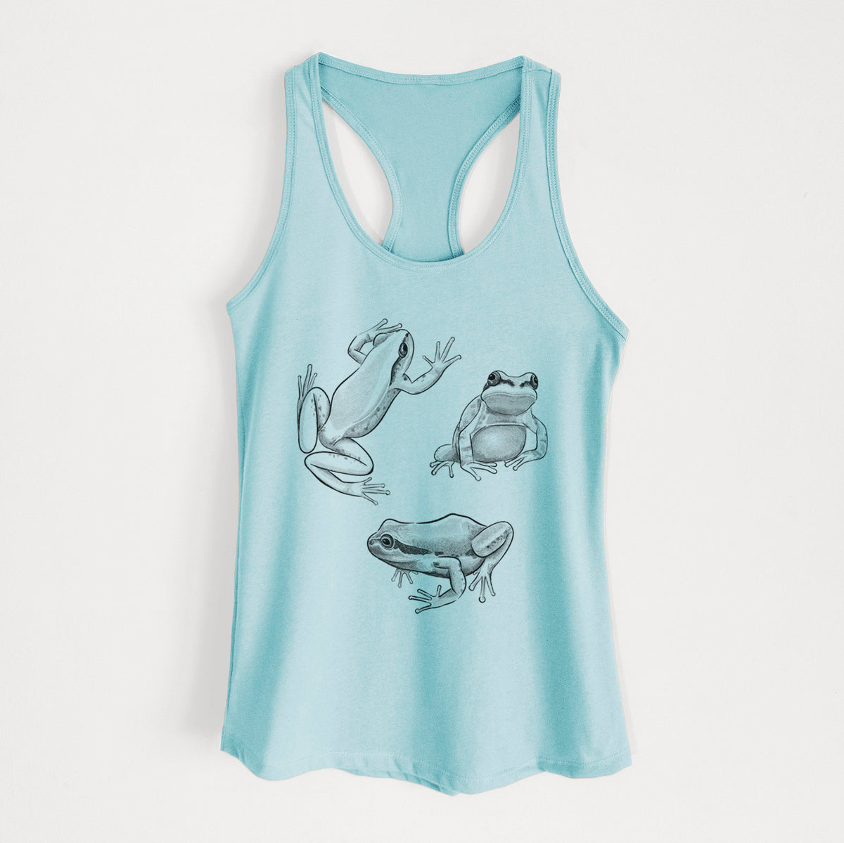 Cancun blue women's racerback tank top laid flat, printed with a black ink illustration of three Pacific tree frogs in different poses.