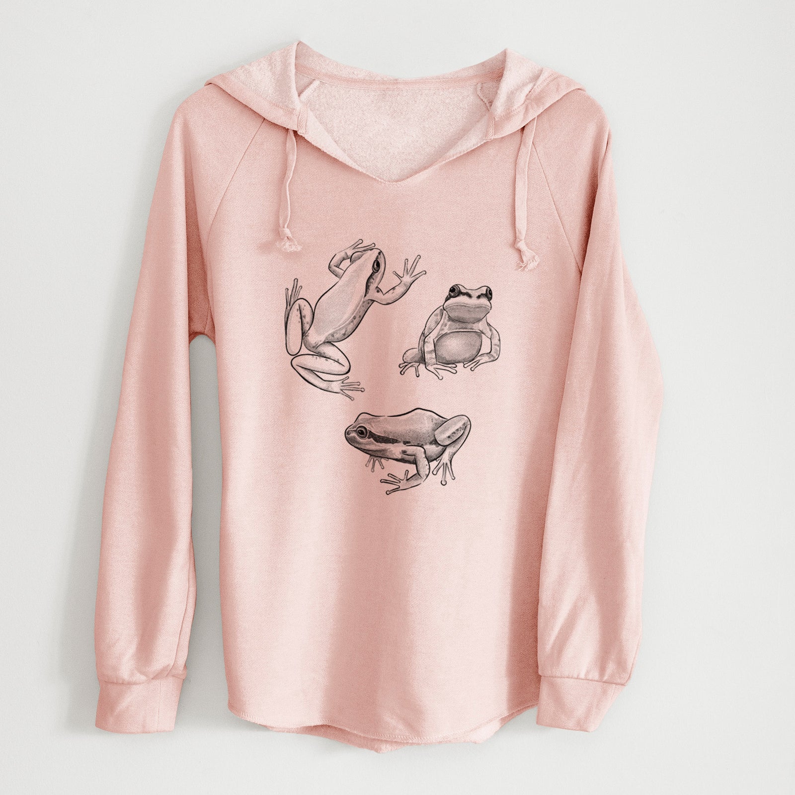 Sage green women's Cali Wave hooded sweatshirt laid flat, printed with a black ink illustration of three Pacific tree frogs in different poses.