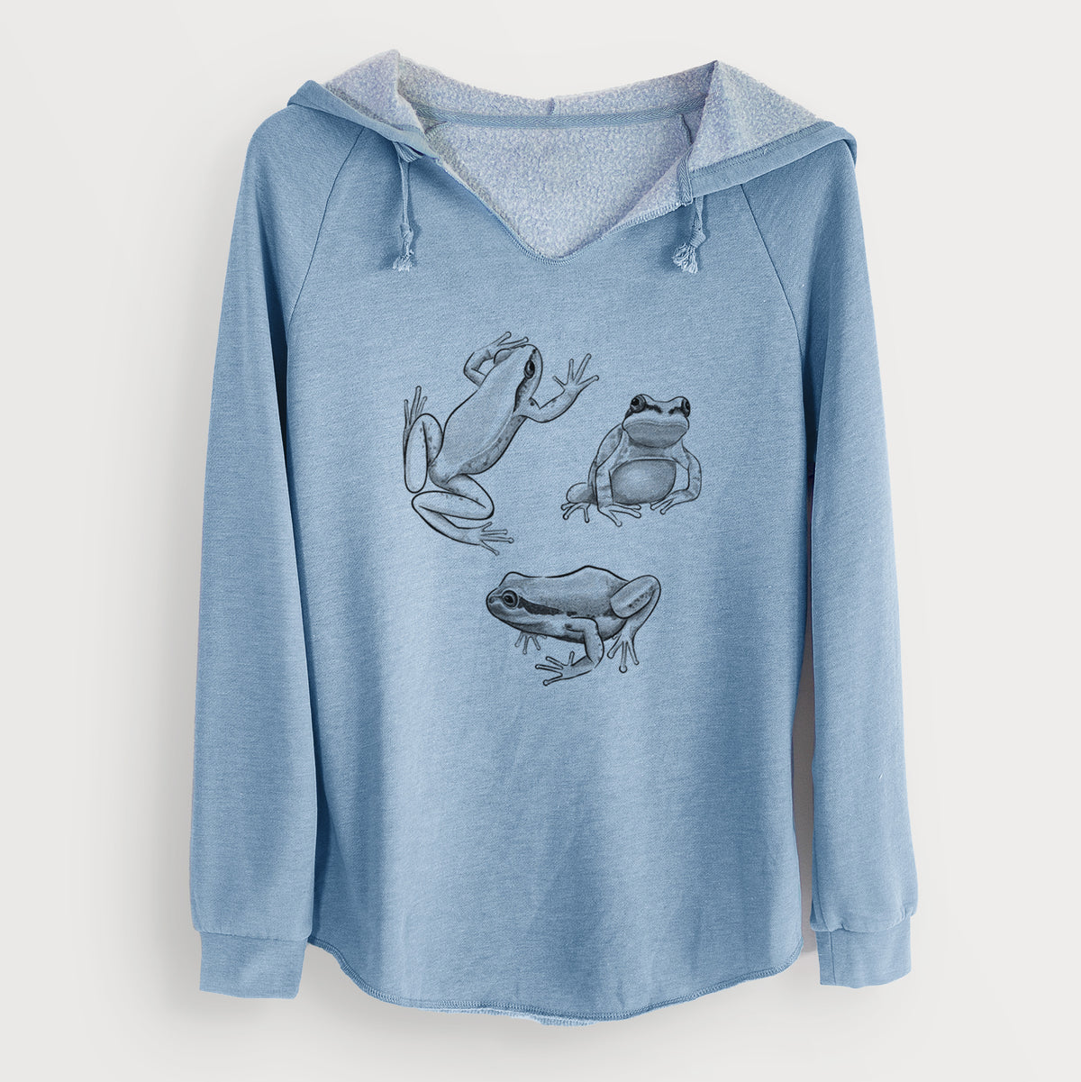 Misty blue women's Cali Wave hooded sweatshirt laid flat, printed with a black ink illustration of three Pacific tree frogs in different poses.