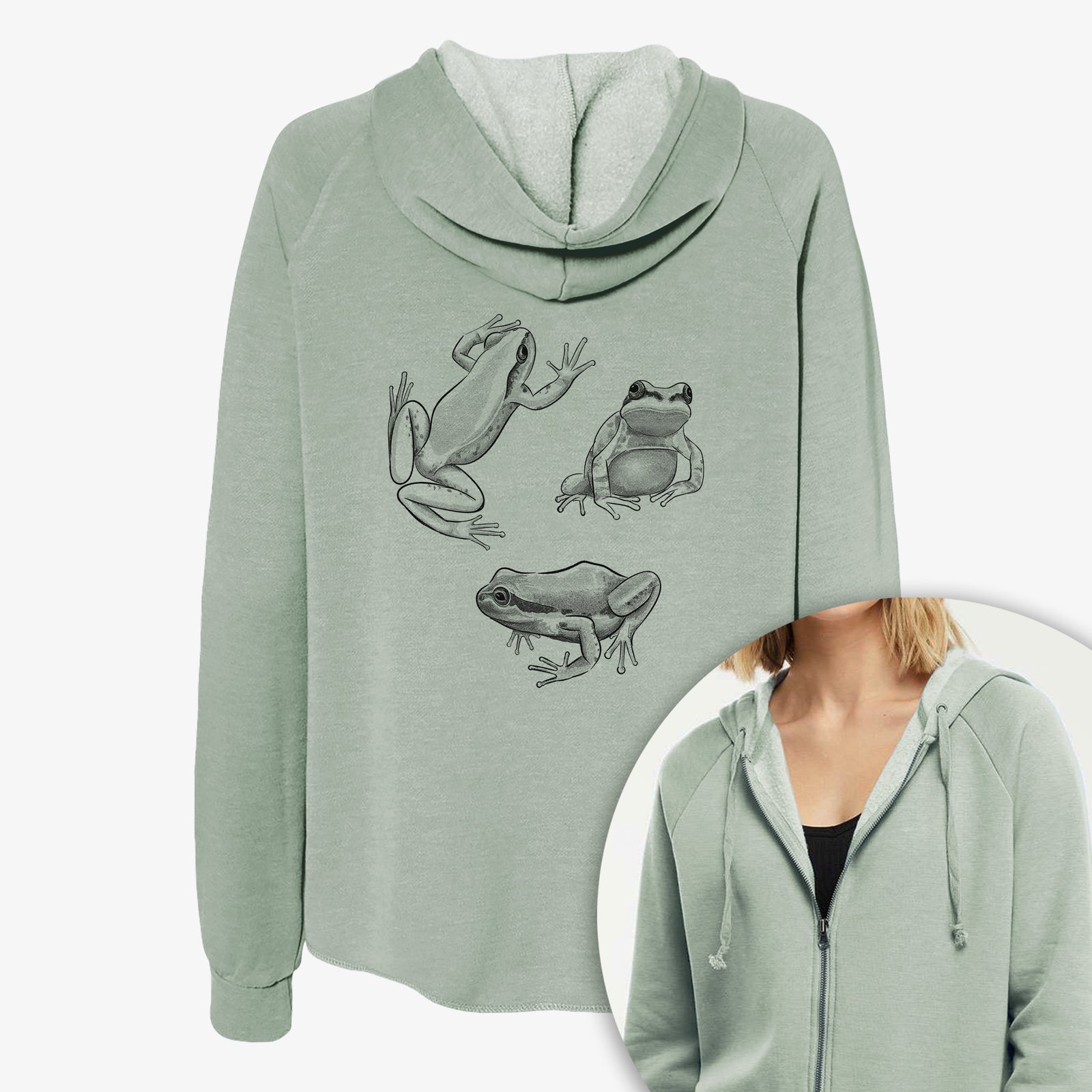 Women's Cali Wave zip-up sweatshirt printed with a black ink illustration of three Pacific tree frogs in different poses, with a close-up of the zipper.