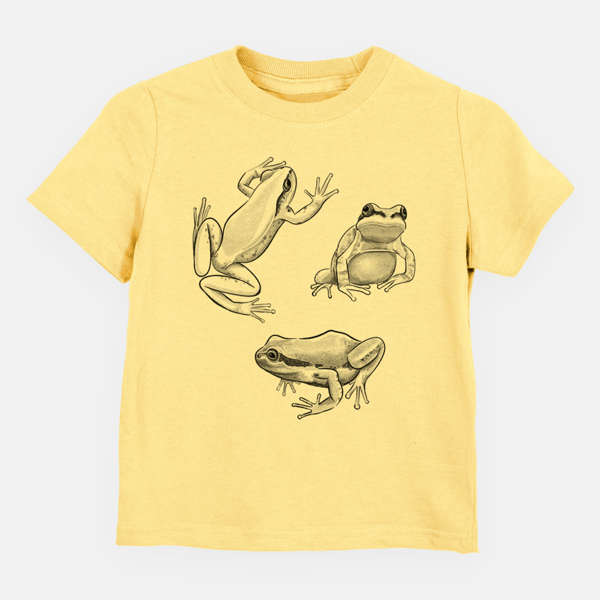Butter yellow toddler t-shirt laid flat, printed with a black ink illustration of three Pacific tree frogs in different poses.