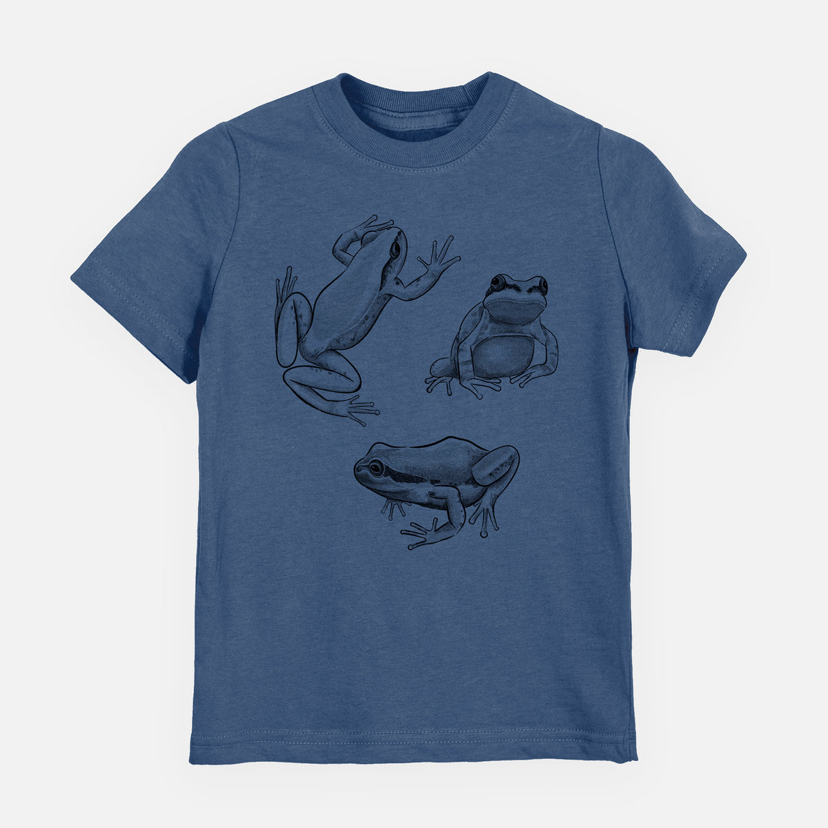 Indigo blue youth t-shirt laid flat, printed with a black ink illustration of three Pacific tree frogs in different poses.