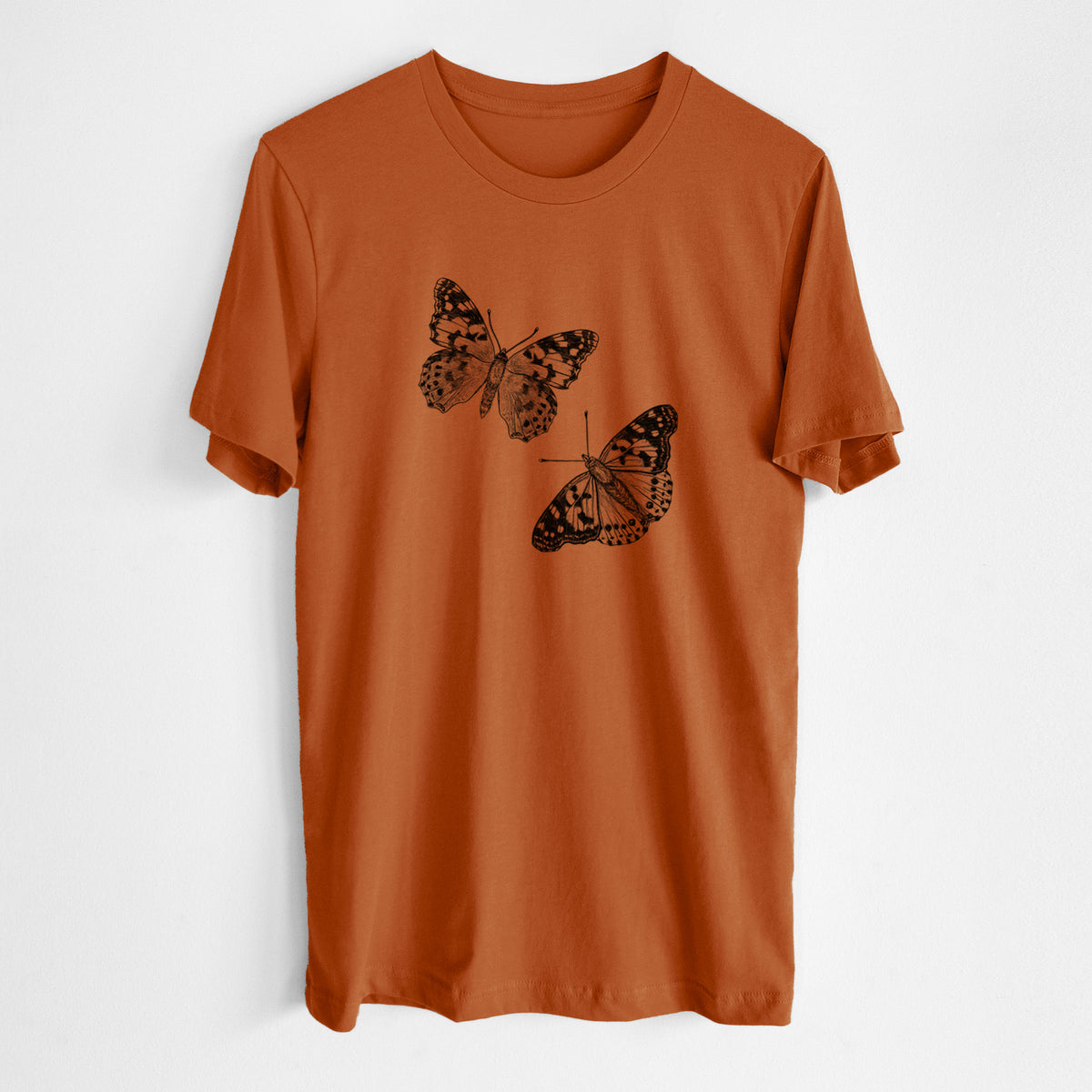 Autumn lightweight cotton t-shirt laid flat, printed with a detailed black ink illustration of two painted lady butterflies.