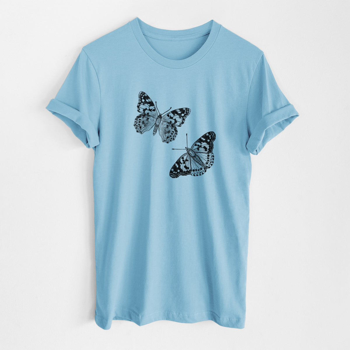 Ocean blue lightweight cotton t-shirt laid flat, printed with a detailed black ink illustration of two painted lady butterflies.
