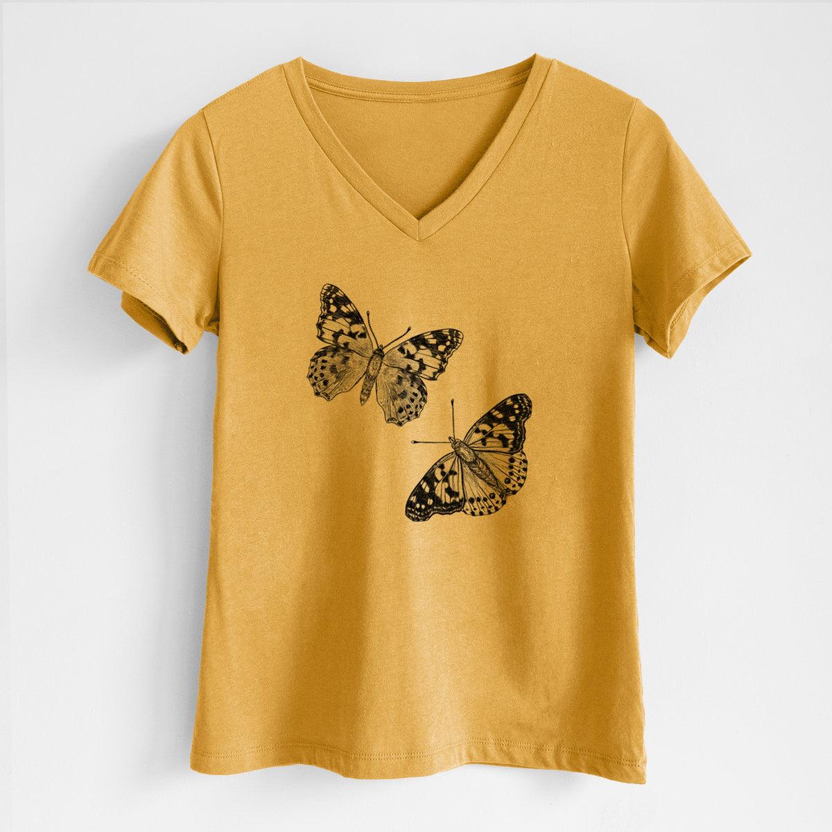 Honeycomb yellow women's relaxed fit cotton V-neck t-shirt laid flat, printed with a detailed black ink illustration of two painted lady butterflies.