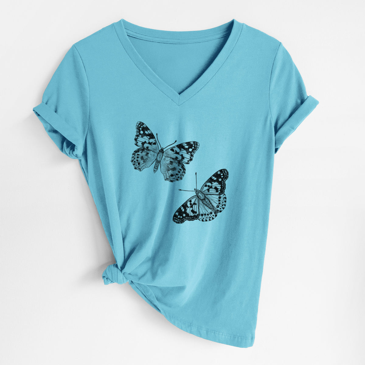 Turquoise women's relaxed fit cotton V-neck t-shirt laid flat, printed with a detailed black ink illustration of two painted lady butterflies.