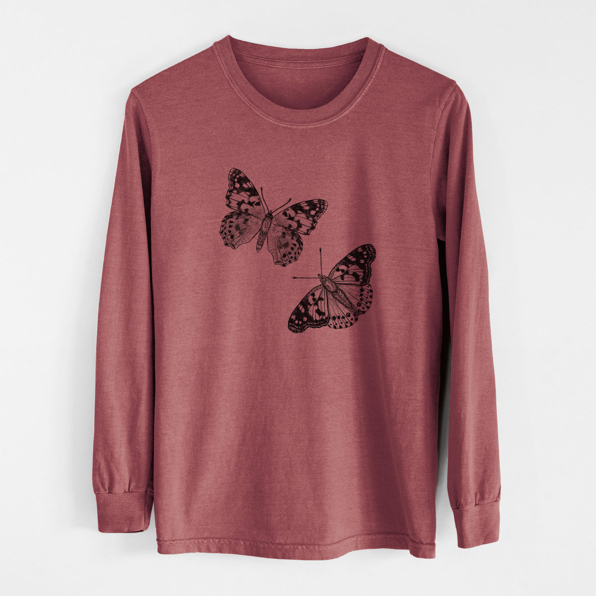 Brick red Comfort Colors long sleeve shirt laid flat, printed with a detailed black ink illustration of two painted lady butterflies.
