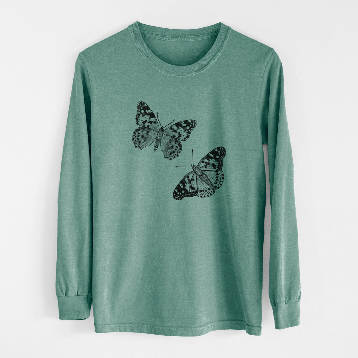 Pine green Comfort Colors long sleeve shirt laid flat, printed with a detailed black ink illustration of two painted lady butterflies.