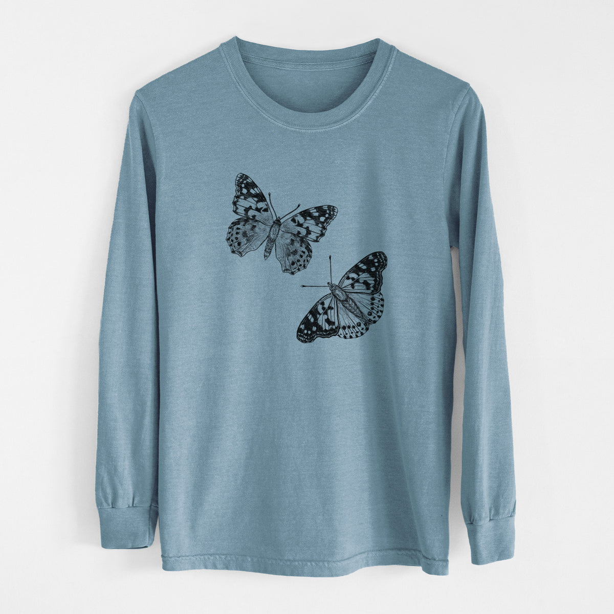 Steel blue Comfort Colors long sleeve shirt laid flat, printed with a detailed black ink illustration of two painted lady butterflies.