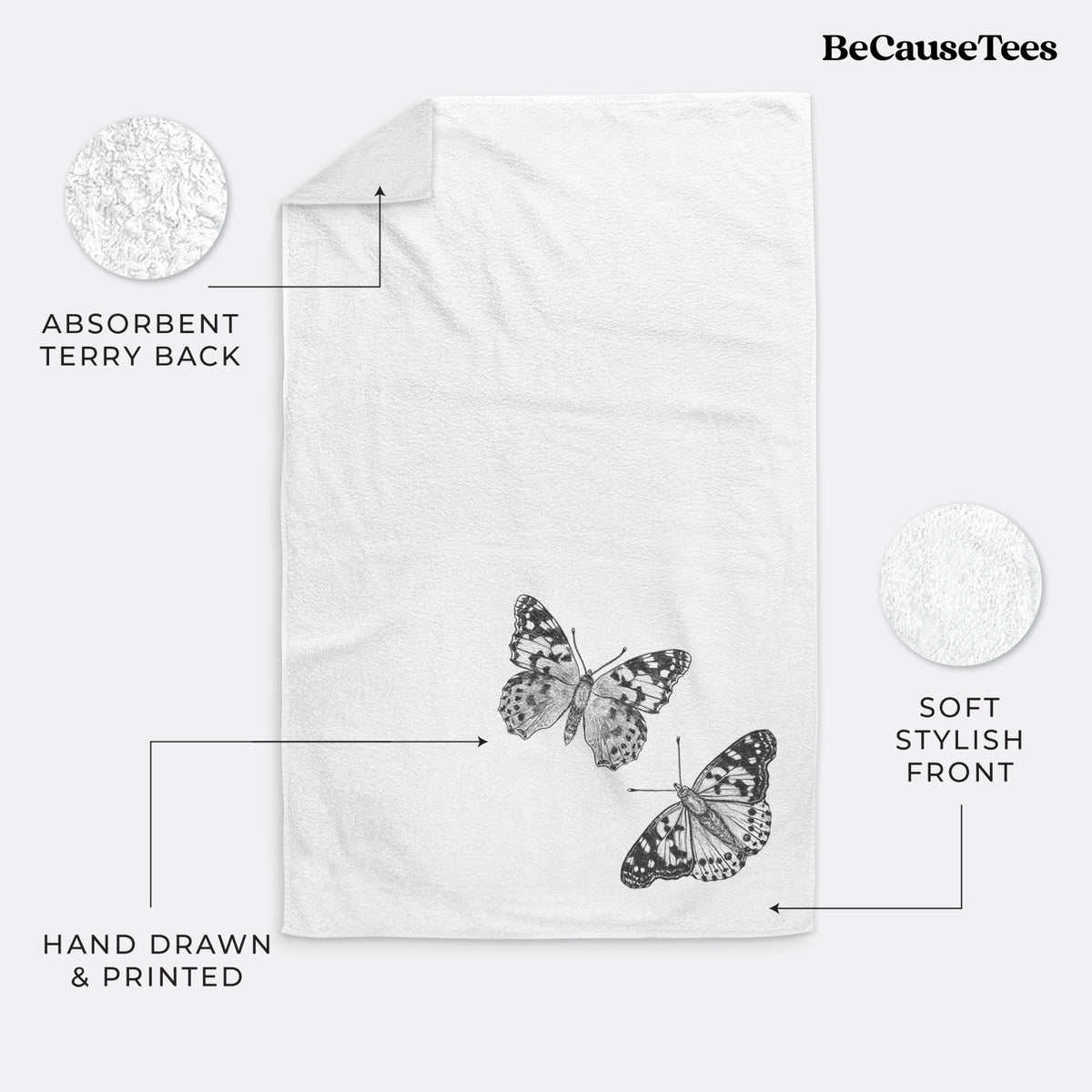 White hand towel printed with a detailed black ink illustration of two painted lady butterflies.