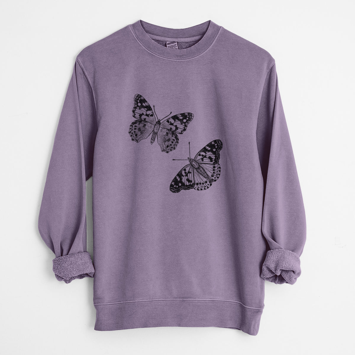Plum purple pigment dyed crewneck sweatshirt laid flat with the sleeves rolled, printed with a detailed black ink illustration of two painted lady butterflies.