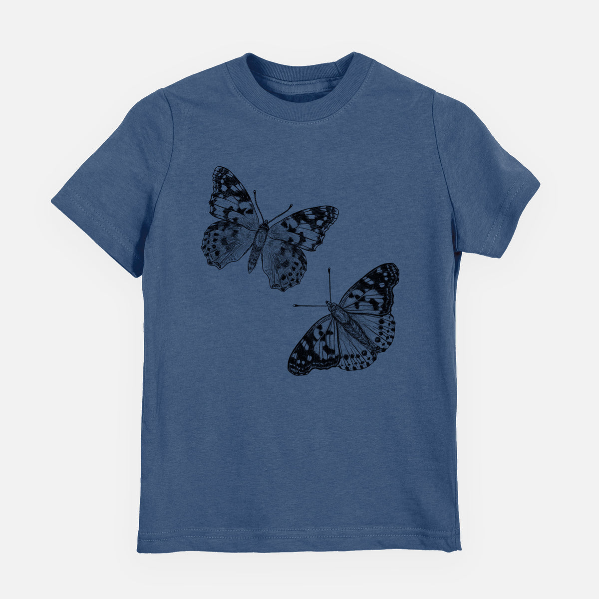Indigo blue youth t-shirt laid flat, printed with a detailed black ink illustration of two painted lady butterflies.