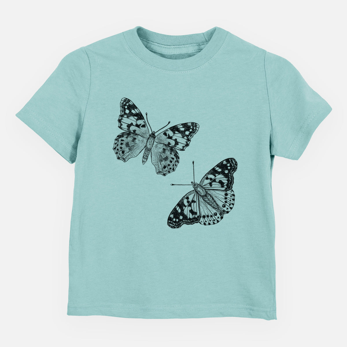 Saltwater toddler t-shirt laid flat, printed with a detailed black ink illustration of two painted lady butterflies.