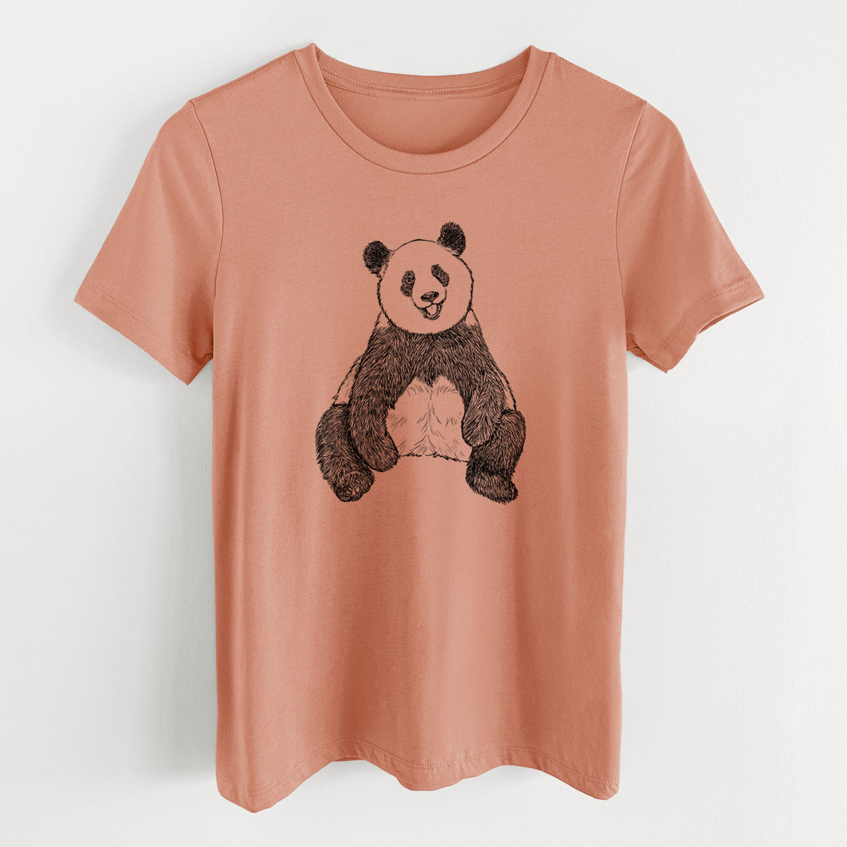 Terracotta orange women's relaxed fit cotton t-shirt laid flat, printed with a black ink illustration of a giant panda sitting and facing forward.