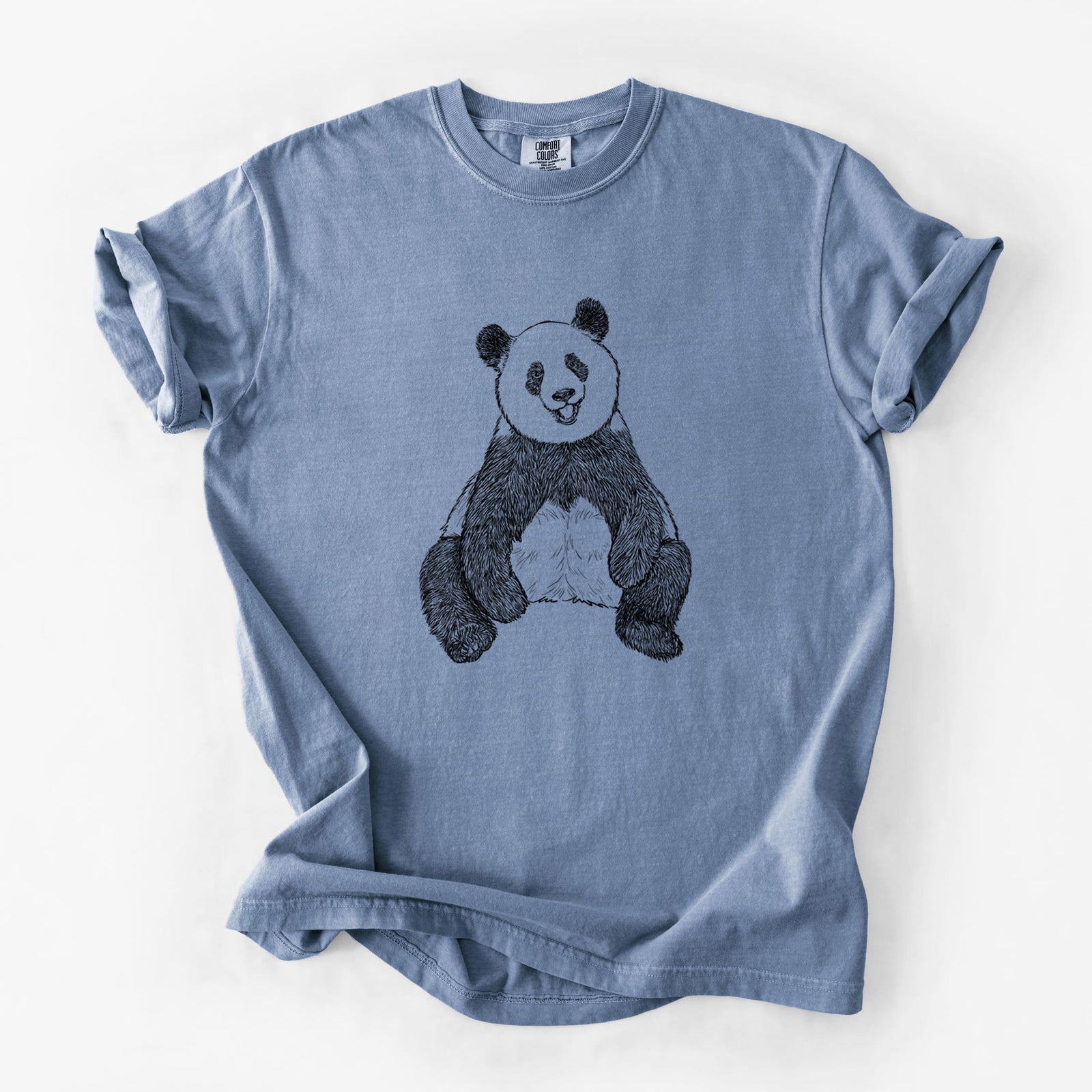 Blue jean Comfort Colors t-shirt laid flat, printed with a black ink illustration of a giant panda sitting and facing forward.