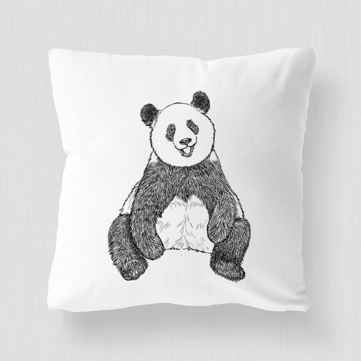 White pillow cover printed with a black ink illustration of a giant panda sitting and facing forward.