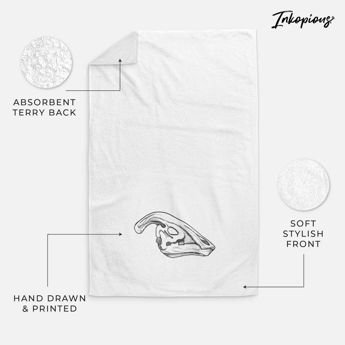 White hand towel printed with a detailed black ink illustration of a crested Parasaurolophus skull.