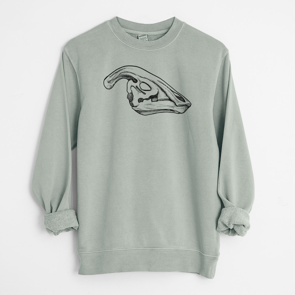 Sage green pigment dyed crewneck sweatshirt laid flat with the sleeves rolled, printed with a detailed black ink illustration of a crested Parasaurolophus skull.