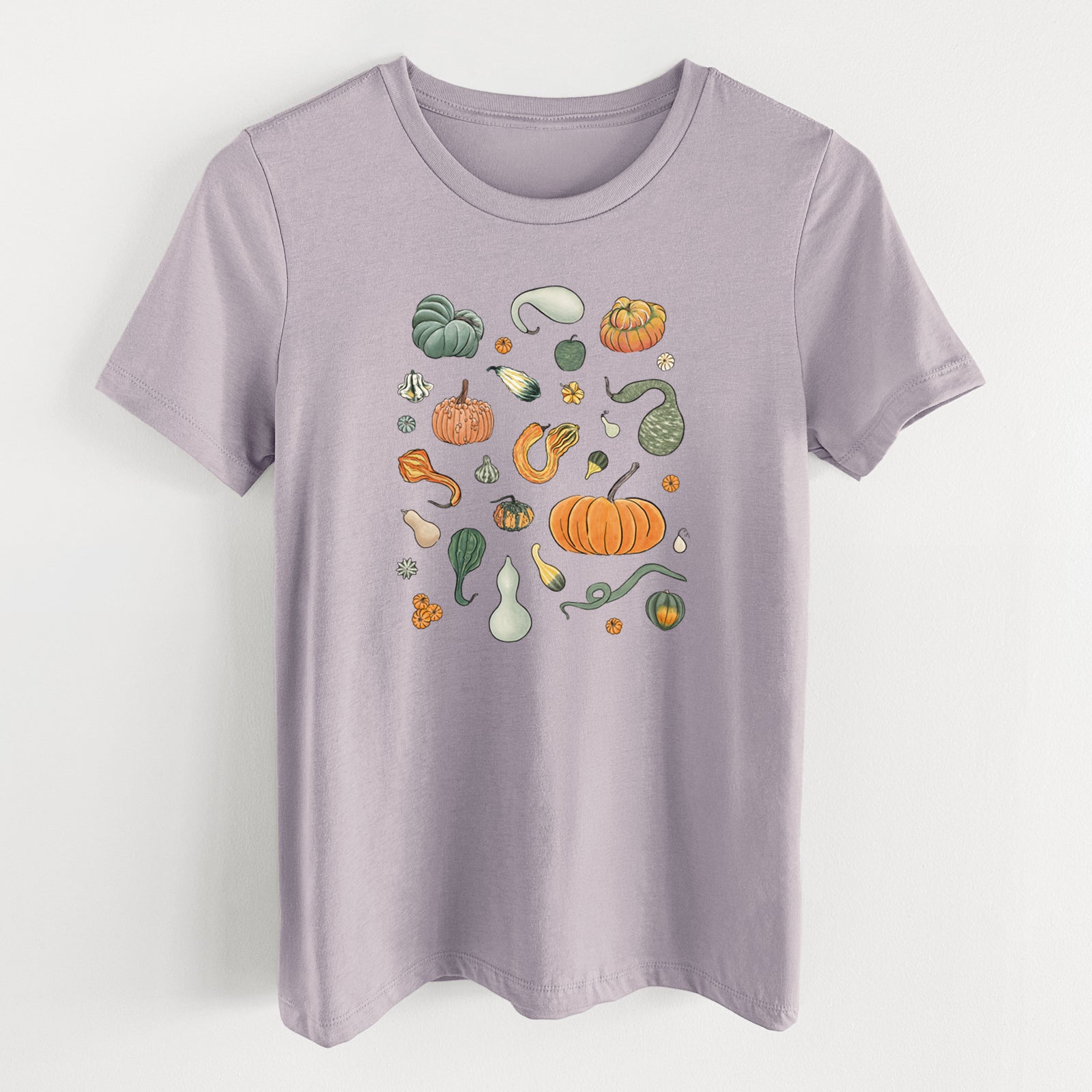 Light violet women's relaxed fit cotton t-shirt laid flat, printed with a full-color collection of pumpkins, squash and gourds in many shapes and colors.
