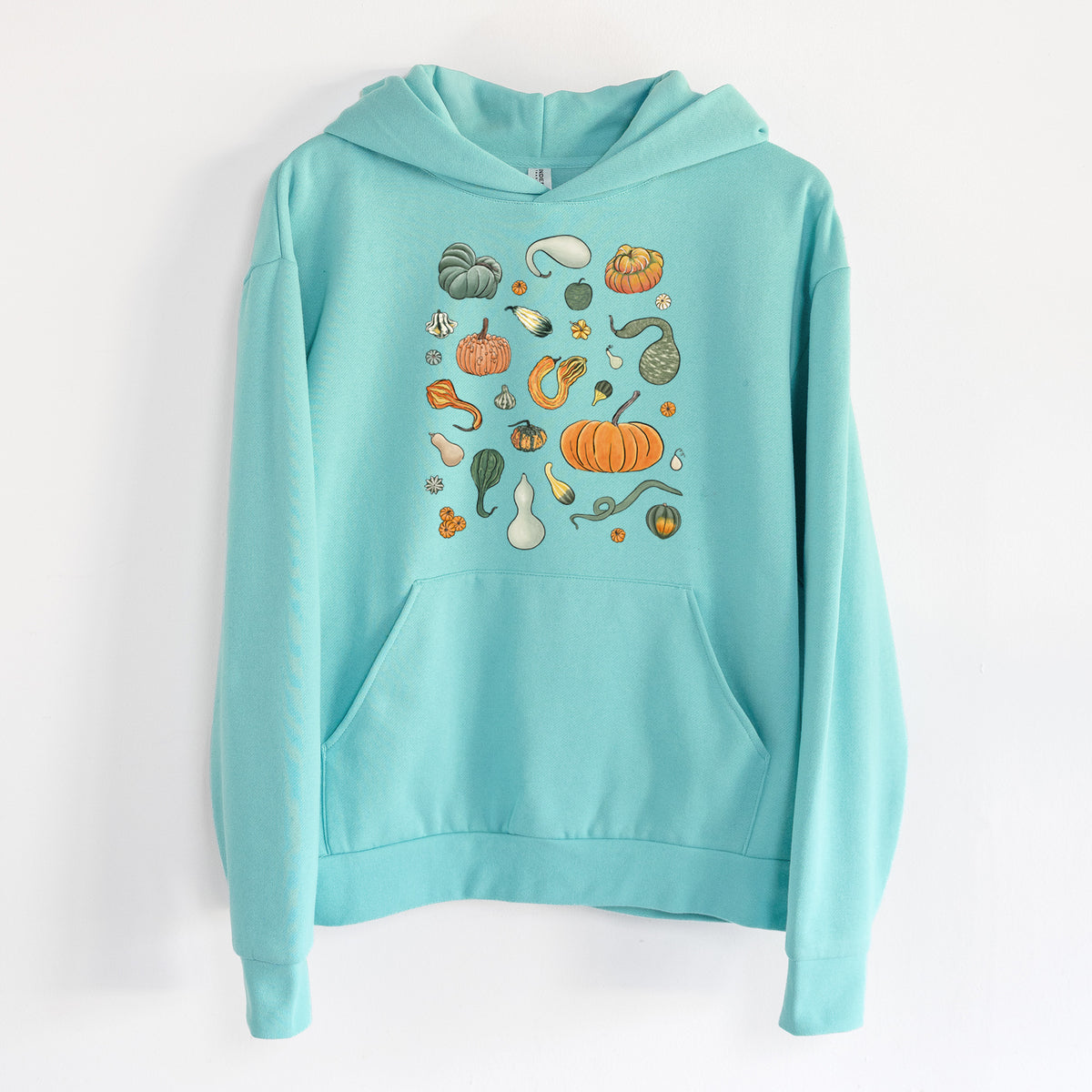 Pumpkin Patch Finds - Statement Midweight Hoodie in Seafoam, hanging on a white wall, with a front kangaroo pocket and no drawcords.