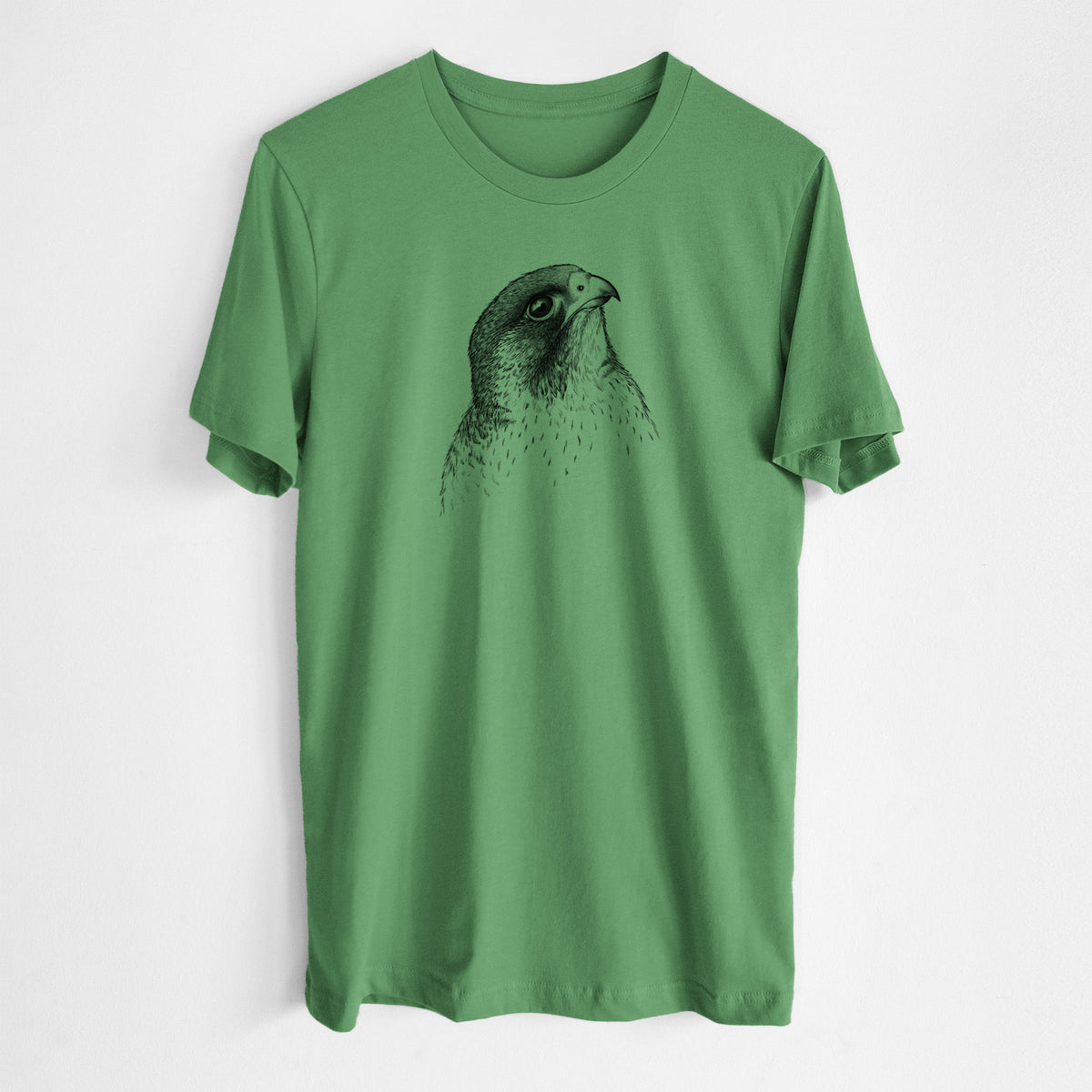 Leaf green lightweight cotton t-shirt laid flat, printed with a detailed black ink portrait of a peregrine falcon's head.