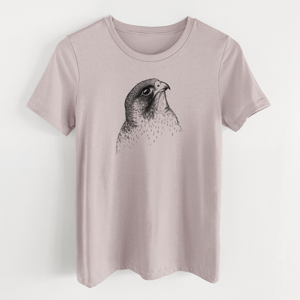 Pink gravel women's relaxed fit cotton t-shirt laid flat, printed with a detailed black ink portrait of a peregrine falcon's head.